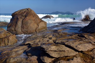 Swell on the rocky coast of Lopes Mendes Beach