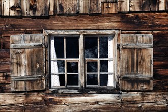 Old wooden window of a mountain hut