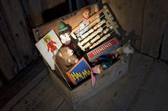 Old toys in a wooden chest