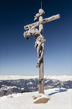 Summit cross on the Rasciesa above Ortisei in Val Gardena