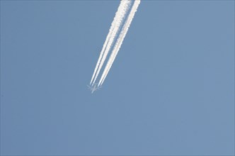 Contrails left by a four-engine airliner