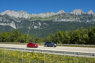Vehicles on the A3 motorway in front of the Churfirsten range near Lake Walen