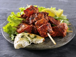 Chicken Tikka with salad and naan bread