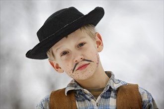 Boy dressed as a cowboy during carnival