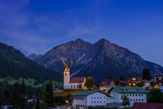 Village Hirschegg with mountains Elferkopf and Zwolferkopf at dusk