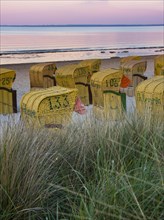 Beach chairs on the beach at dusk