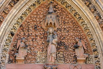 The Virgin Mary with angels in the tympanum of the portal of the Gothic St. Elizabeth's Church