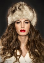Young woman with fur hat