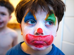 Child with a clown makeup