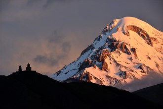 Summit of Mount Kazbek with Zminda Sameba pilgrims monastery