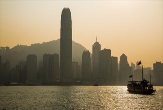 Junk in front of the skyline of Hong Kong Island with the skyscraper Two International Finance Centre