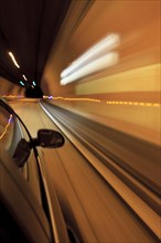 Car driving through a tunnel