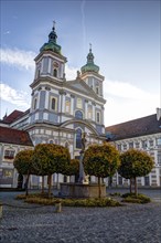 Collegiate Basilica of Waldsassen with a fountain and Basilikaplatz square