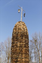 A built-up wooden tower with witches for the bonfire
