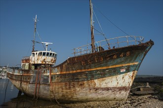 Wreck of an old painted wooden ship