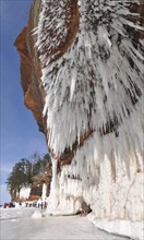 Icicles hanging from red sandstone along the shore of Lake Superior