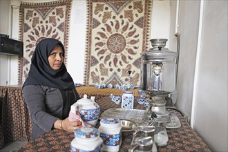 Woman preparing Iranian tea