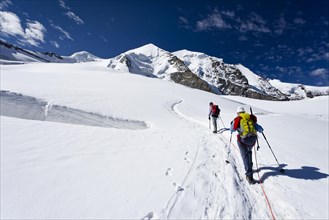 Mountain climbers ascending to Piz Palu Mountain