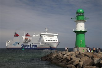Lighthouse on the western pier and a Stena Line ferry