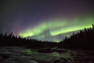 Northern lights or aurora borealis over river