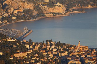 Menton with the port of Garavan and the border to Italy in the evening light