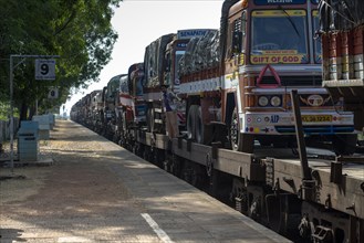Trucks transported on train