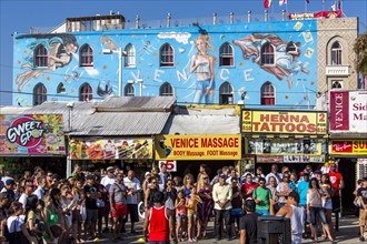 People in front of painted facade in Venice Beach