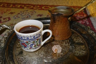 Turkish coffee in a cup with Turkish delight
