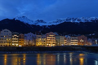 Buildings on the Inn River at dusk