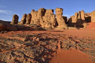 Eroded sandstone rocks and dunes at the cirque