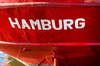 Word 'Hamburg' on a ship in the port