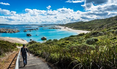 Woman walking down to Greens Pool in William Bay National Park