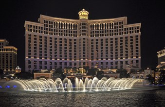 Bellagio Hotel and Casino with dancing water fountain show at night