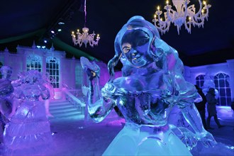 Female ice figure in front of a fairytale castle made of ice