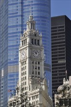 Clock tower of the Wrigley Buildingin the glass facade of Trump International Hotel and Tower