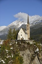 Reformed Church of St. George in front of mountains