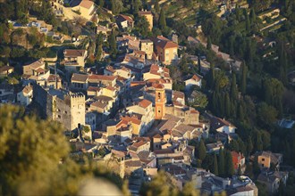 Roquebrune village with its medieval castle and church in the evening light