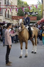 Female rider on Andalusian horse at the annual All Saints Market in Cocentaina
