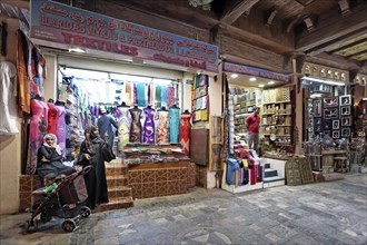 Local women with prams in the Muttrah Souq market