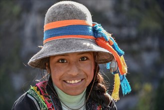 Indio girl with hat smiles