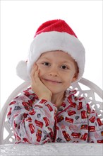 Child wearing a Santa Claus hat