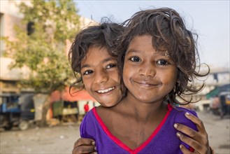 Two smiling street kids