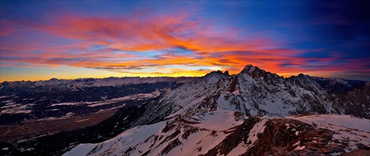 Hafelekar station of the Nordkettenbahnen cable car during a dramatic sunset with Mt Brandjochspitze in the back