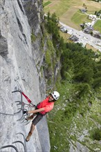 Female climber on the fixed rope route 'Via ferrata d'Evolene Region'