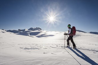 Ski tourer during the ascent of Mt Seekofel near St Vigil or San Vigilio di Marebbe