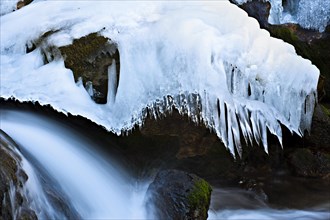 Myra Falls with ice in winter in Muggendorf