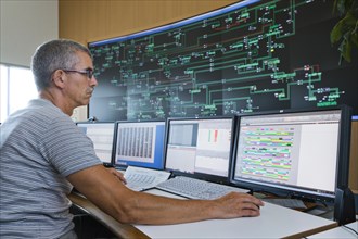 Engineer sitting at his work station in the Transmission Control Center