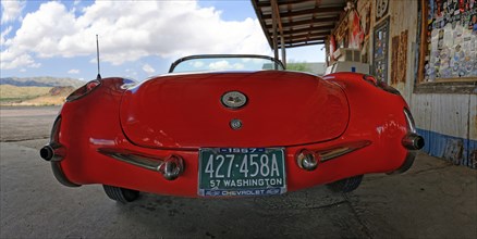 Rear view of a red vintage Chevrolet Corvette Convertible 1957