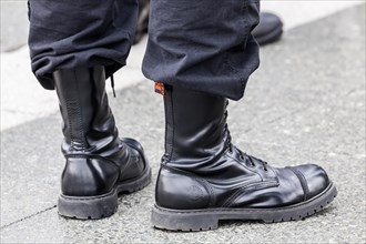 Member of a right-wing Hungarian party wearing combat boots