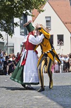 Peasant dancing with a jester